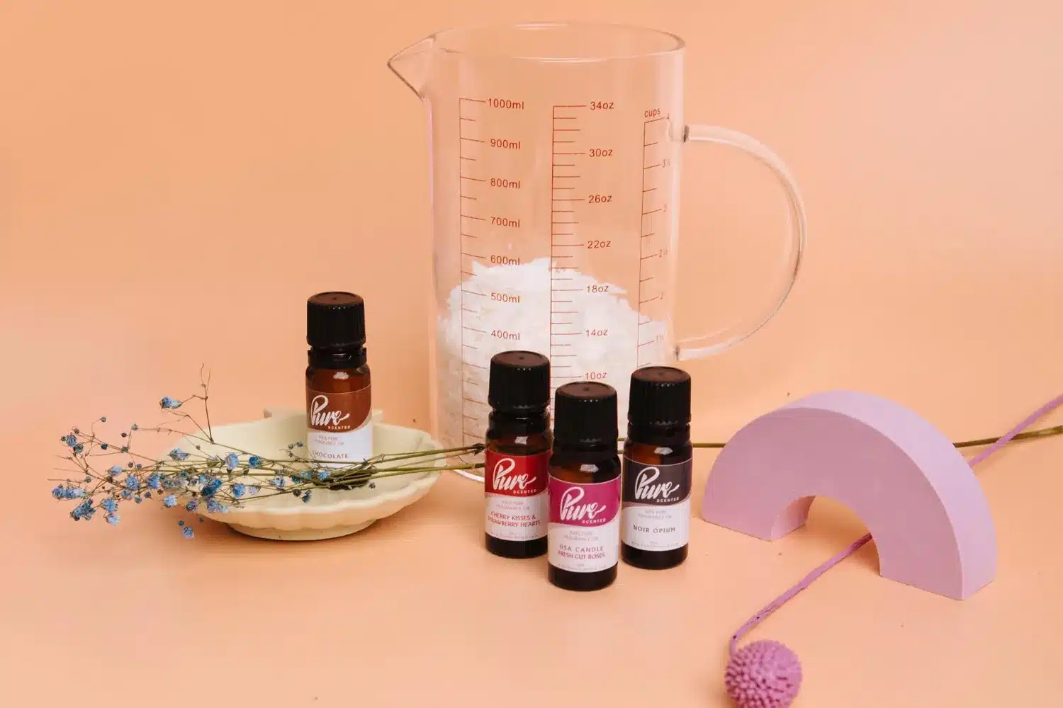 Pure Scented 10ml fragrance oil bottles with a measuring jug of wax flakes